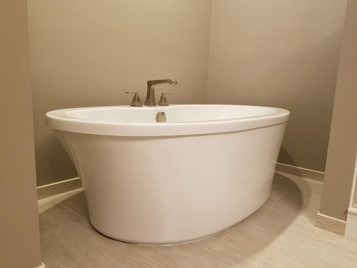 Soaker tub with Delta faucet