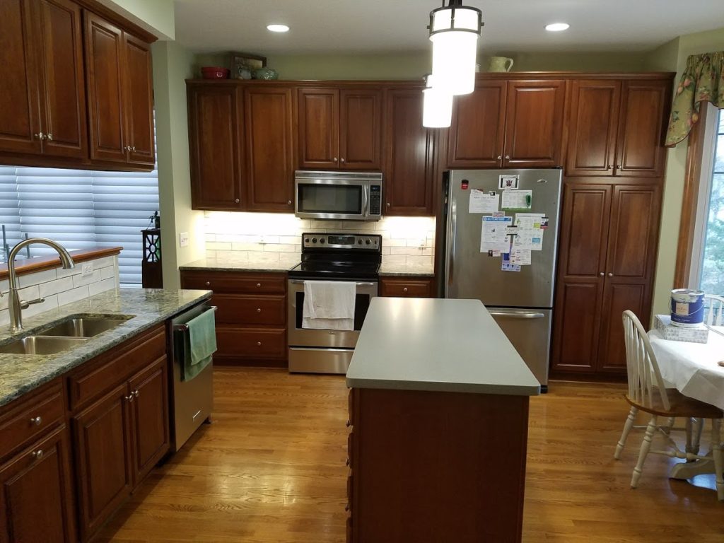 Kitchen with Cherry Cabinets & Green Accents